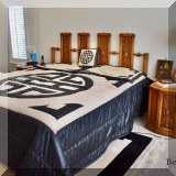 F32. Vargas Furniture king bed with Ergomotion massage mattress. 48”h